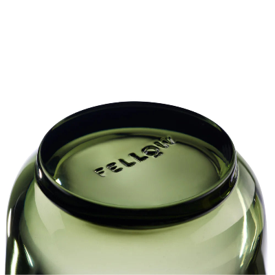 Close-up of a green coffee cup featuring the 'Fellow' brand on a white background.