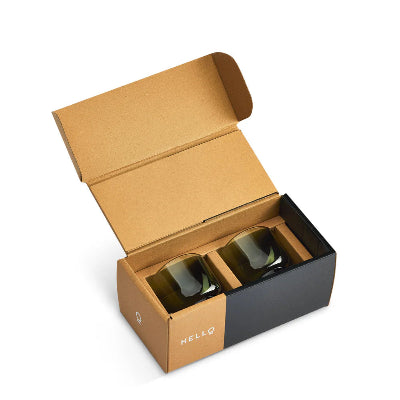Open cardboard box with two coffee glasses inside on a white background