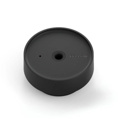 Black circular object with a brand logo on a white background