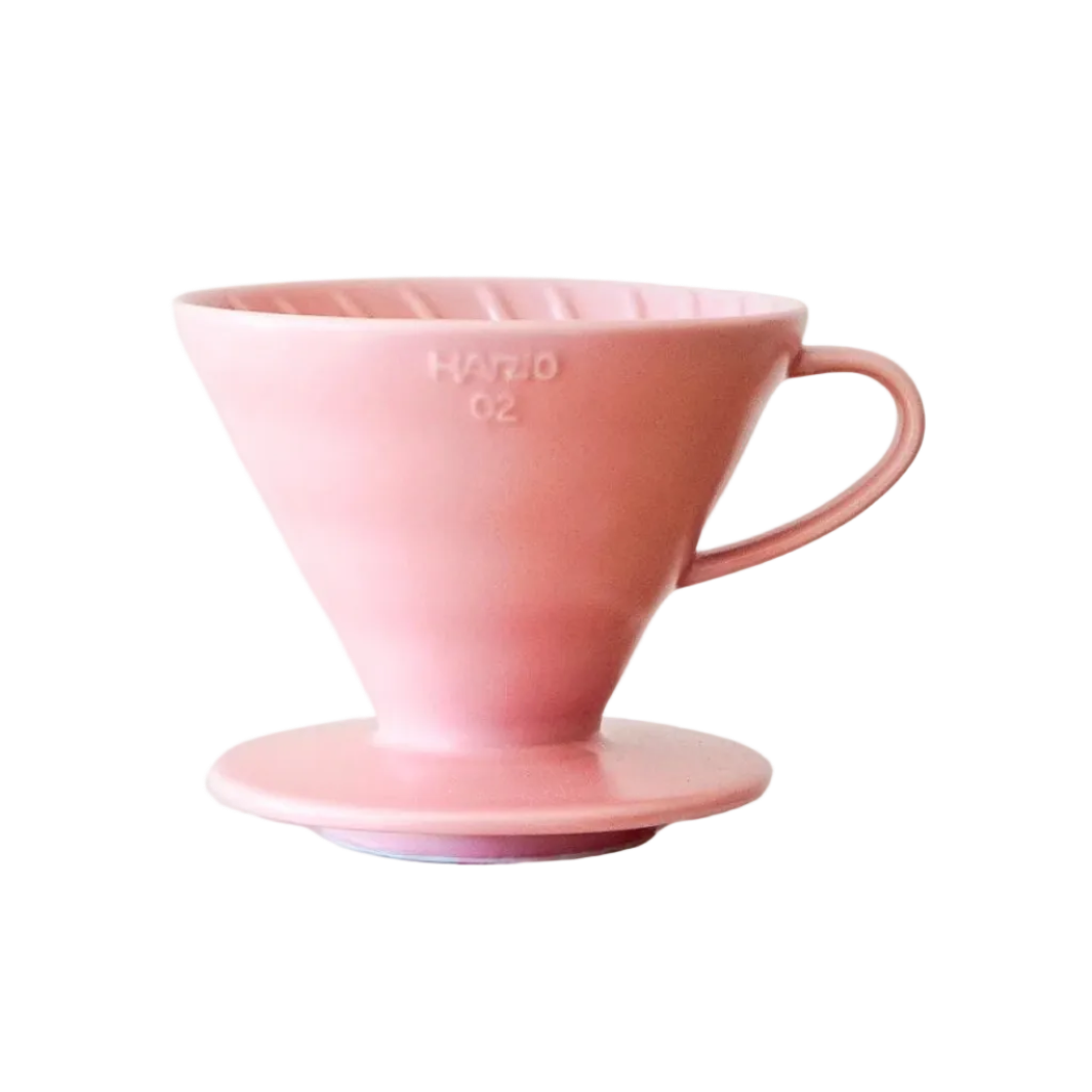 Pink ceramic coffee filter on a white background