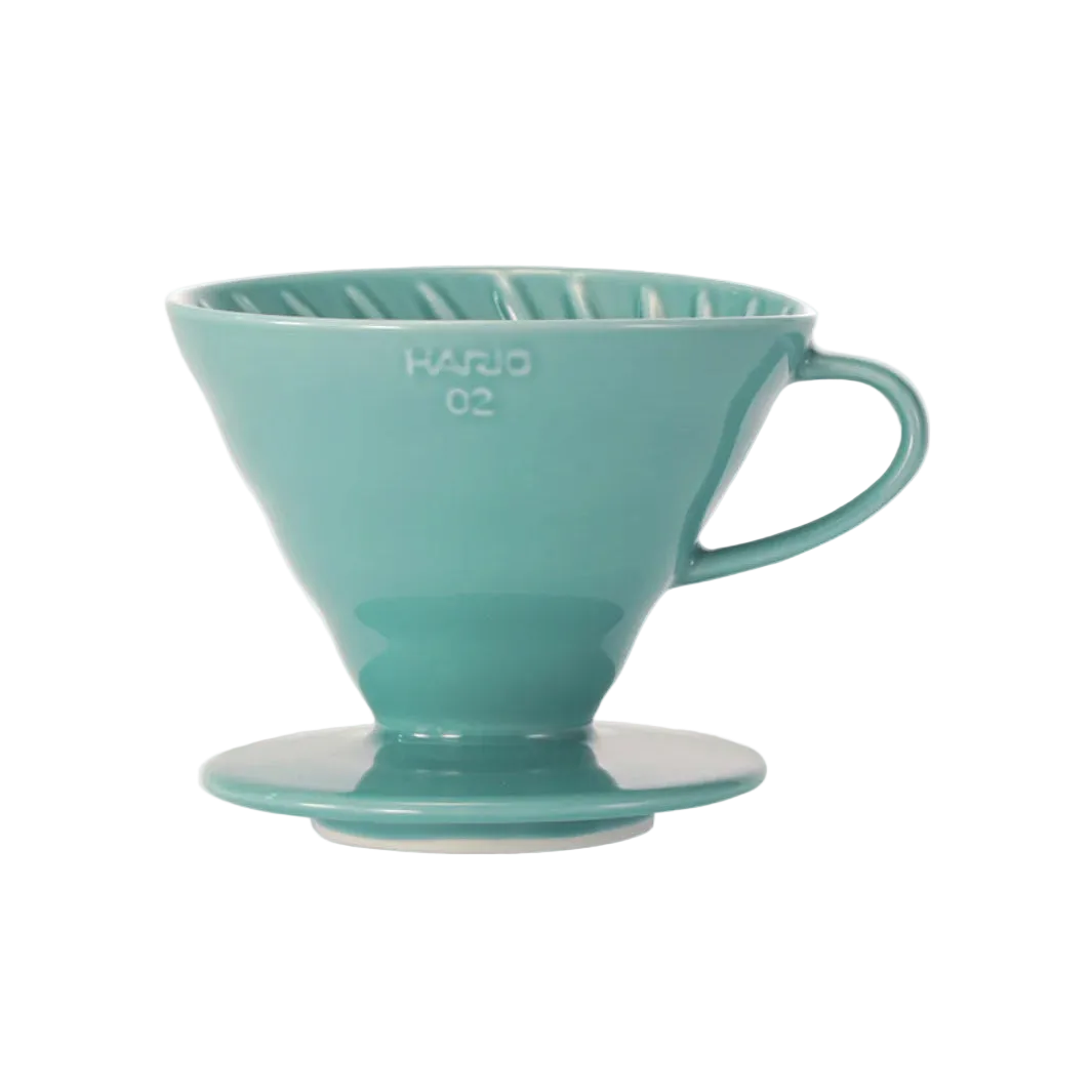 Teal coffee filter on a white background