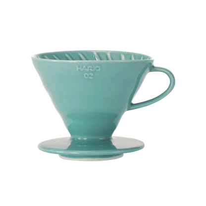 Teal coffee filter on a white background