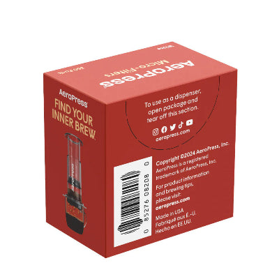 Red AeroPress coffee filters packaging on a white background