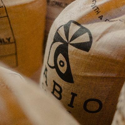 Close-up of a coffee bag with a logo and the word 'Bio' on it.