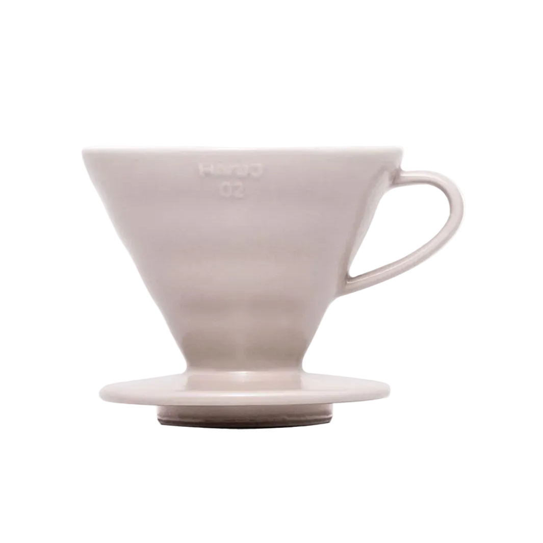 White ceramic coffee dripper on a white background