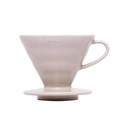 White ceramic coffee dripper on a white background