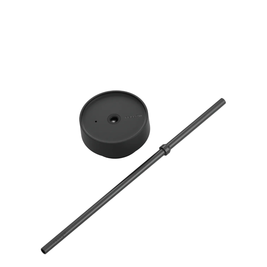 Black metal rod and circular component on a white background