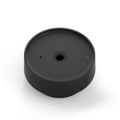 Black circular object with a brand logo on a white background
