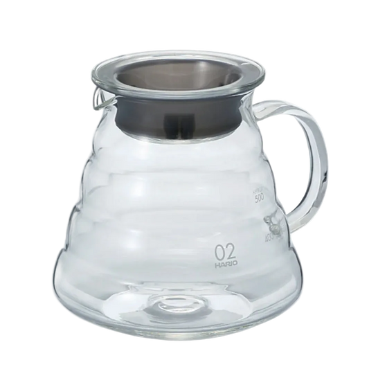 Clear glass coffee server with metal lid on a white background