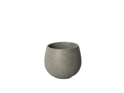 A small, round, speckled gray ceramic cup or planter with a matte finish, centered on a solid white background.