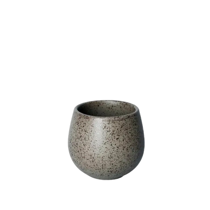 A small ceramic cup with a rounded, bulbous shape and a speckled gray-brown glaze, shown against a plain white background.